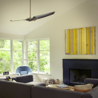 The bright nickel body with nickel blades IC/Air2 DC - 56″ from Modern Fan Co in a living room.