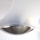 The bright nickel and translucent IC/Brisa DC - 56″ from Modern Fan Co. shown close up in a living room.