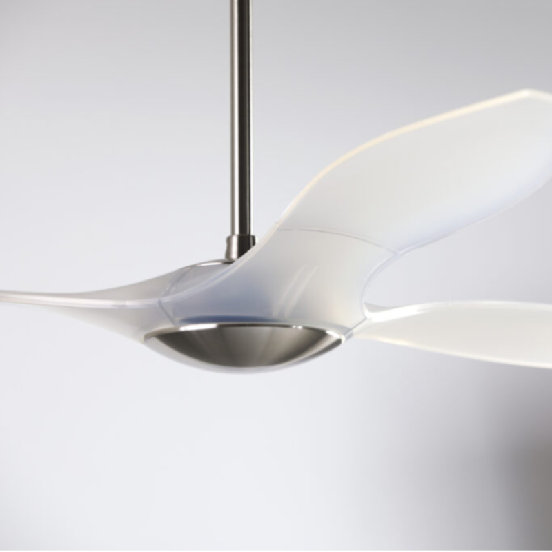 The bright nickel and translucent IC/Brisa DC - 56″ from Modern Fan Co. shown in detail within a living space.
