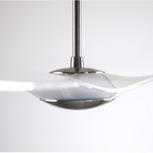 The bright nickel and translucent IC/Brisa DC - 56″ from Modern Fan Co. in a side view within a family space.