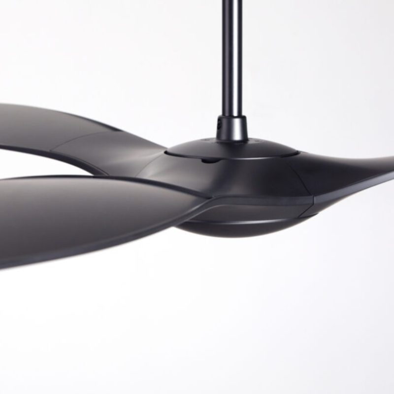 The matte black IC/Brisa DC - 56″ from Modern Fan Co. focusing on the blades within a living space.