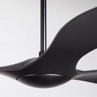 The matte black IC/Brisa DC - 56″ from Modern Fan Co. in a close up within a family area.