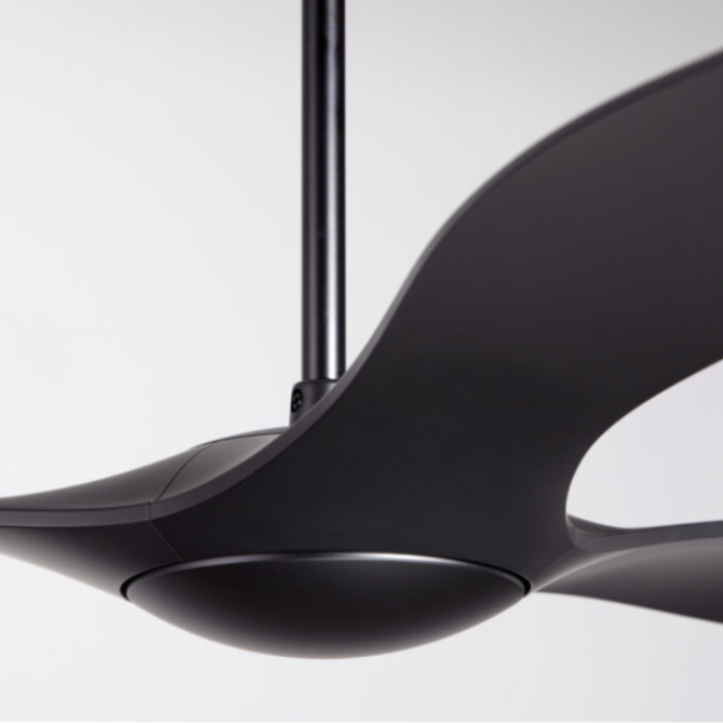 The matte black IC/Brisa DC - 56″ from Modern Fan Co. in a close up within a family area.