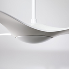 The matte white IC/Brisa DC - 56″ from Modern Fan Co. in a view from the side in a studio.