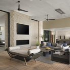 The Torsion 20W LED—62" within a lounge area from Modern Fan Co.