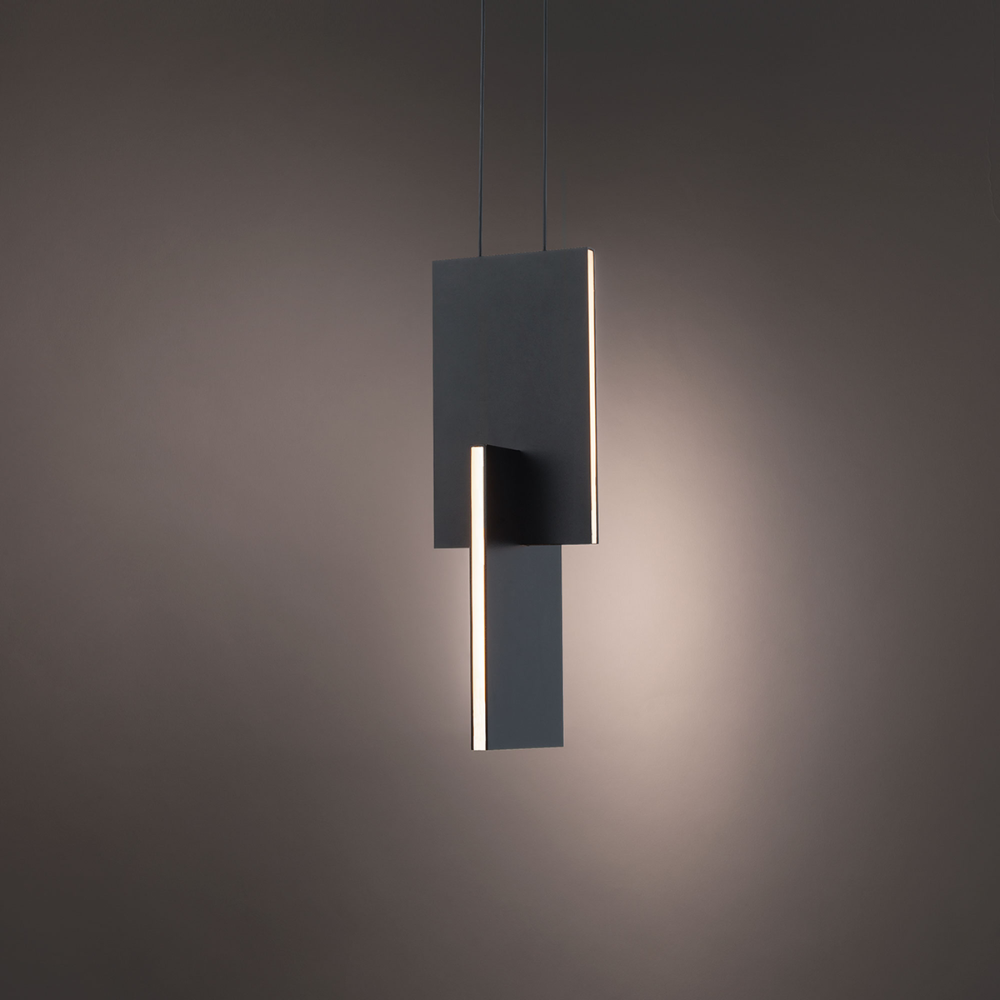 The black Amari Pendant Light from Modern Forms in a studio.