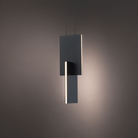The black Amari Pendant Light from Modern Forms in a studio.