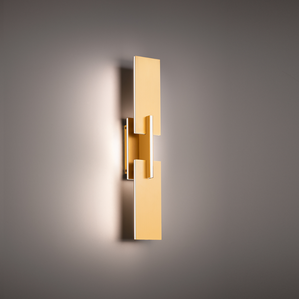 The aged brass Amari Wall Sconce from Modern Forms in a living room.
