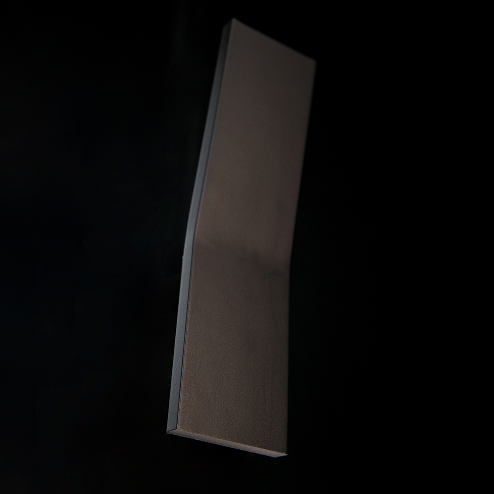 The black Blade Wall Sconce from Modern Forms in a family area.