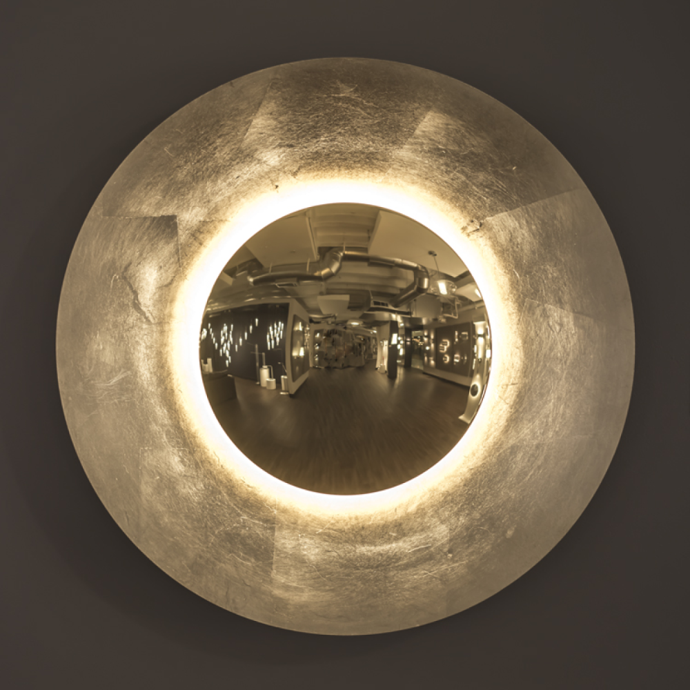 The gold leaf Blaze Wall Sconce from Modern Forms in a living area.