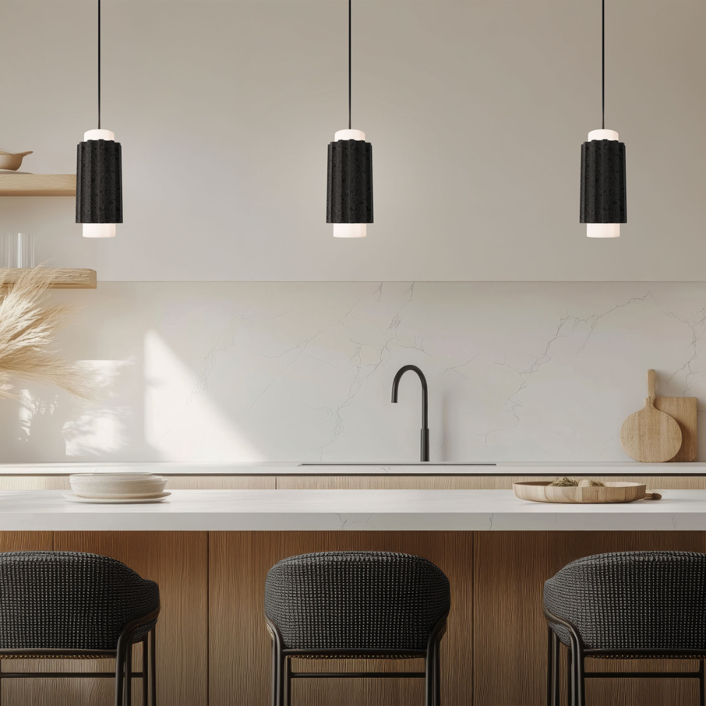 The basalt stone and black Caviar Pendant Light from Modern Forms in a kitchen and dining space.