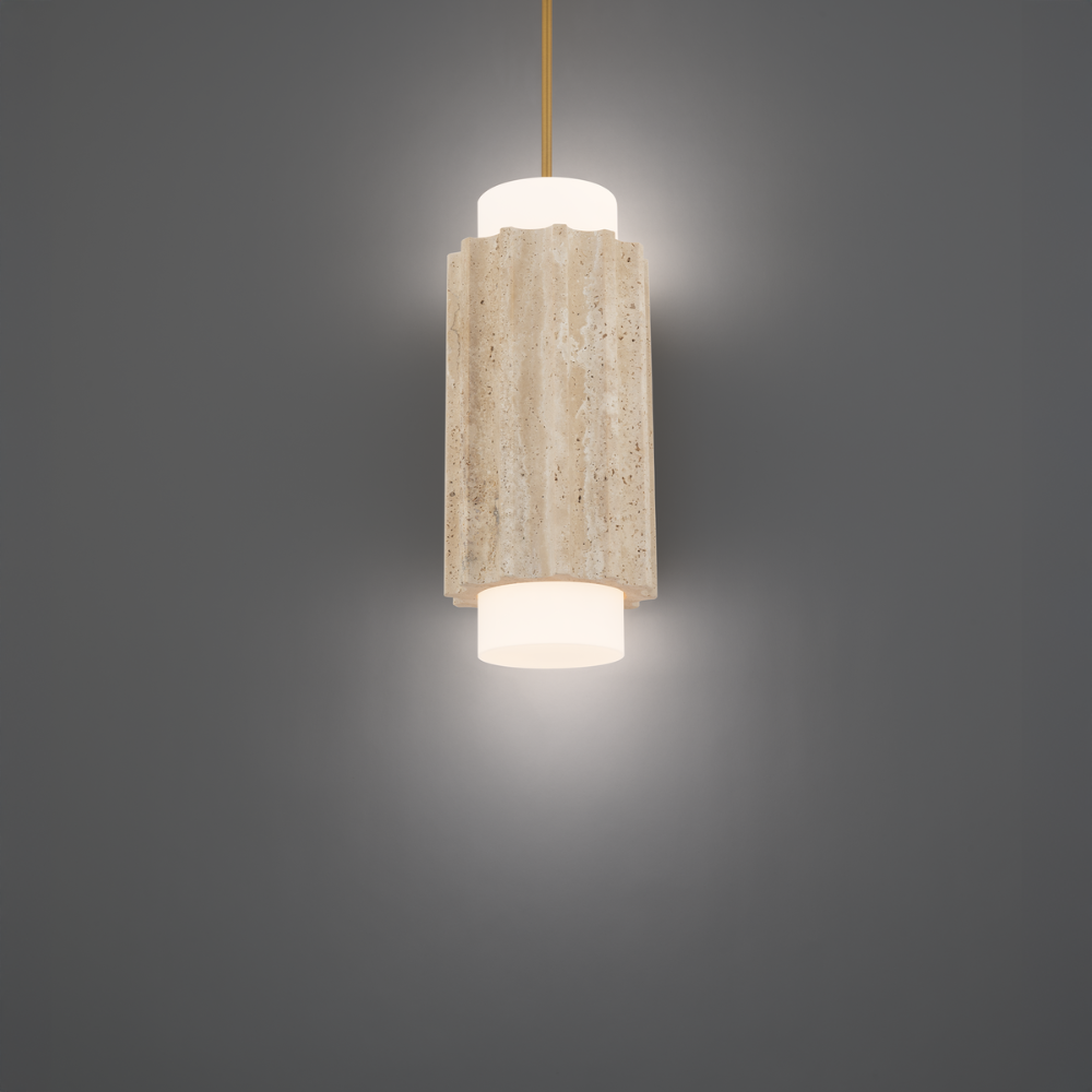 The beige travertine and aged brass Caviar Pendant Light from Modern Forms in a studio.
