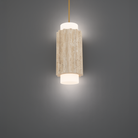 The beige travertine and aged brass Caviar Pendant Light from Modern Forms in a studio.