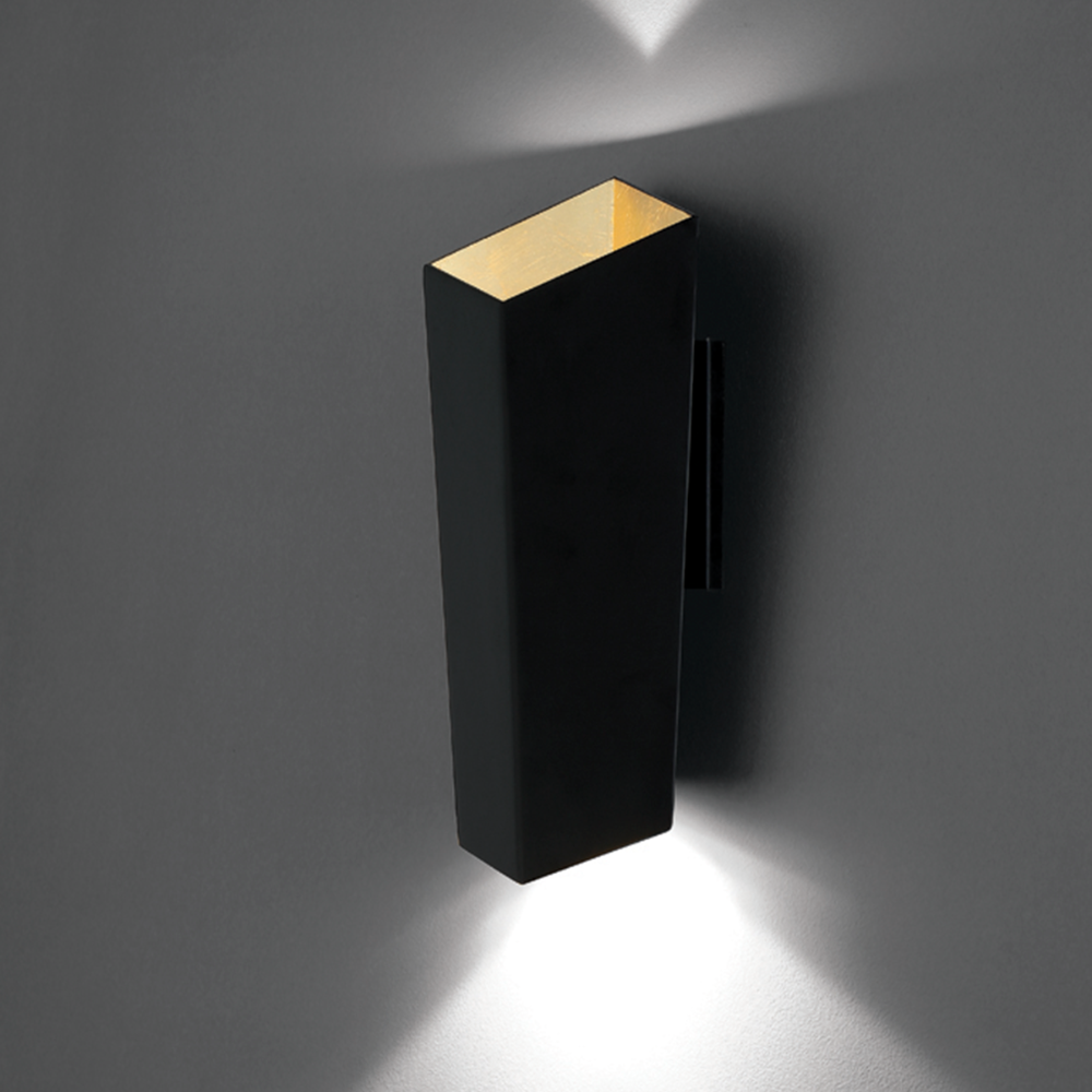 The Dink Wall Sconce from Modern Forms in a living room.