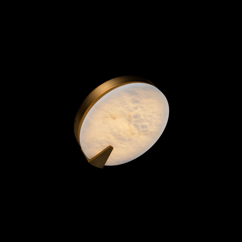 The aged brass Ophelia Wall Sconce from Modern Forms in a living space.