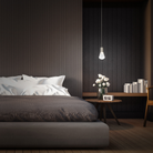 The satin nickel Plum Pendant Light from Modern Forms in a primary bedroom.