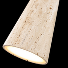 The beige travertine and aged brass Pompeii Pendant Light from Modern Forms in a family space.