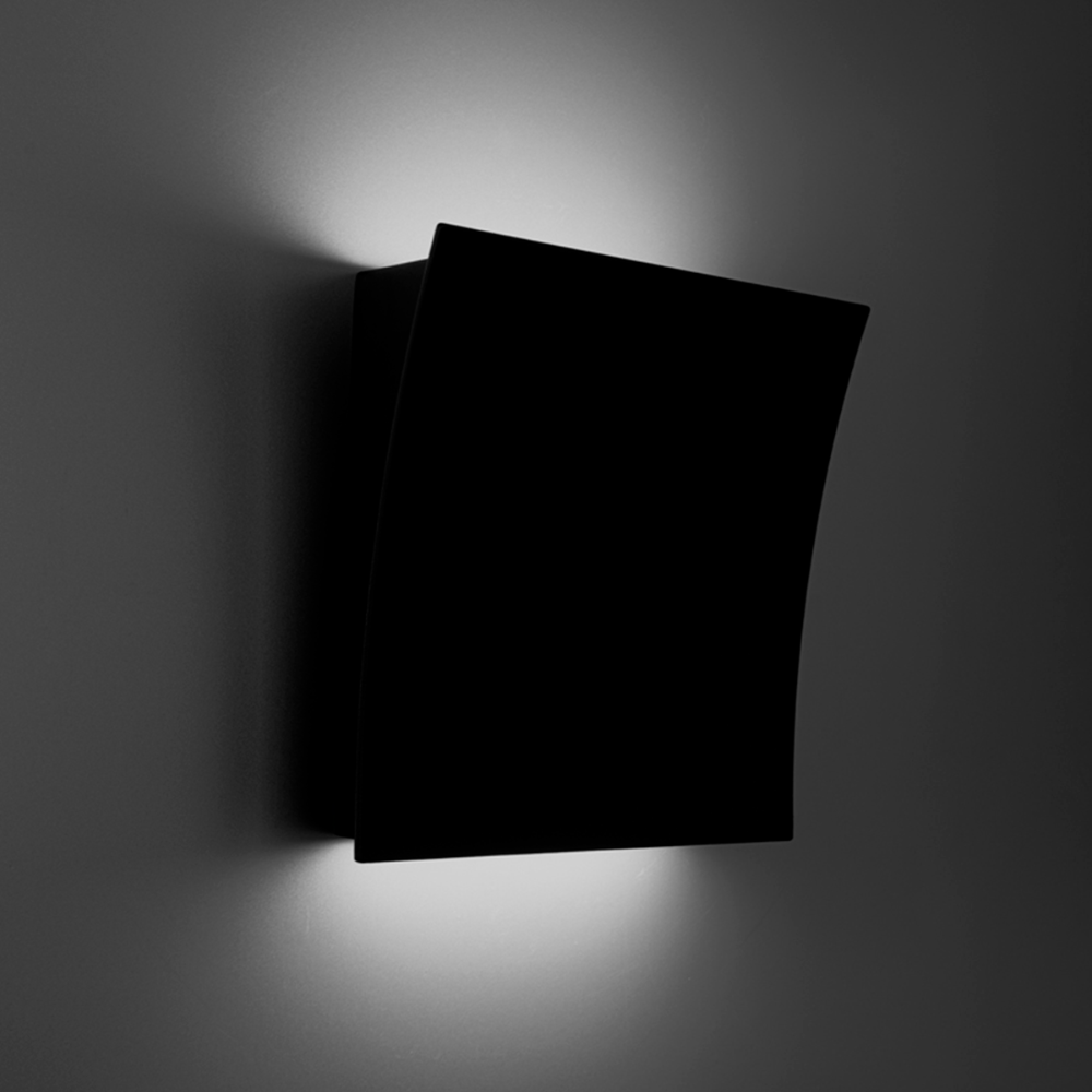 The black Slide Wall Sconce from Modern Forms in a family area.