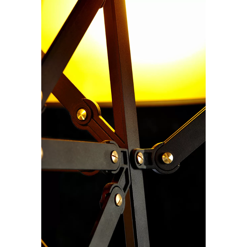 The black Construction Lamp Floor from Moooi in a living room.