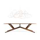 The large thirty one light Flock of Light from Moooi above a dining table in a studio.