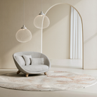 Two Non Random Pendants over a modern lounge chair.