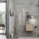 The gray Ambit Pendant Lamp from Muuto in a primary bedroom.