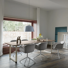 The light blue Ambit Pendant Lamp from Muuto in a family space.