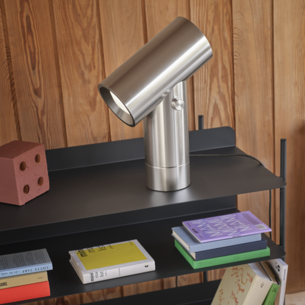 The Beam Table Lamp Aluminum Large from Muuto in a study room.
