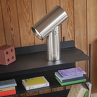 The Beam Table Lamp Aluminum Large from Muuto in a study room.