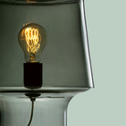 Edison bulb inside a modern lamp by Muuto.