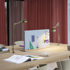 The brown green Dedicate Table Lamp from Muuto in a living room.