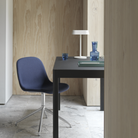 The Linear Table Lamp Gray from Muuto in a living room.