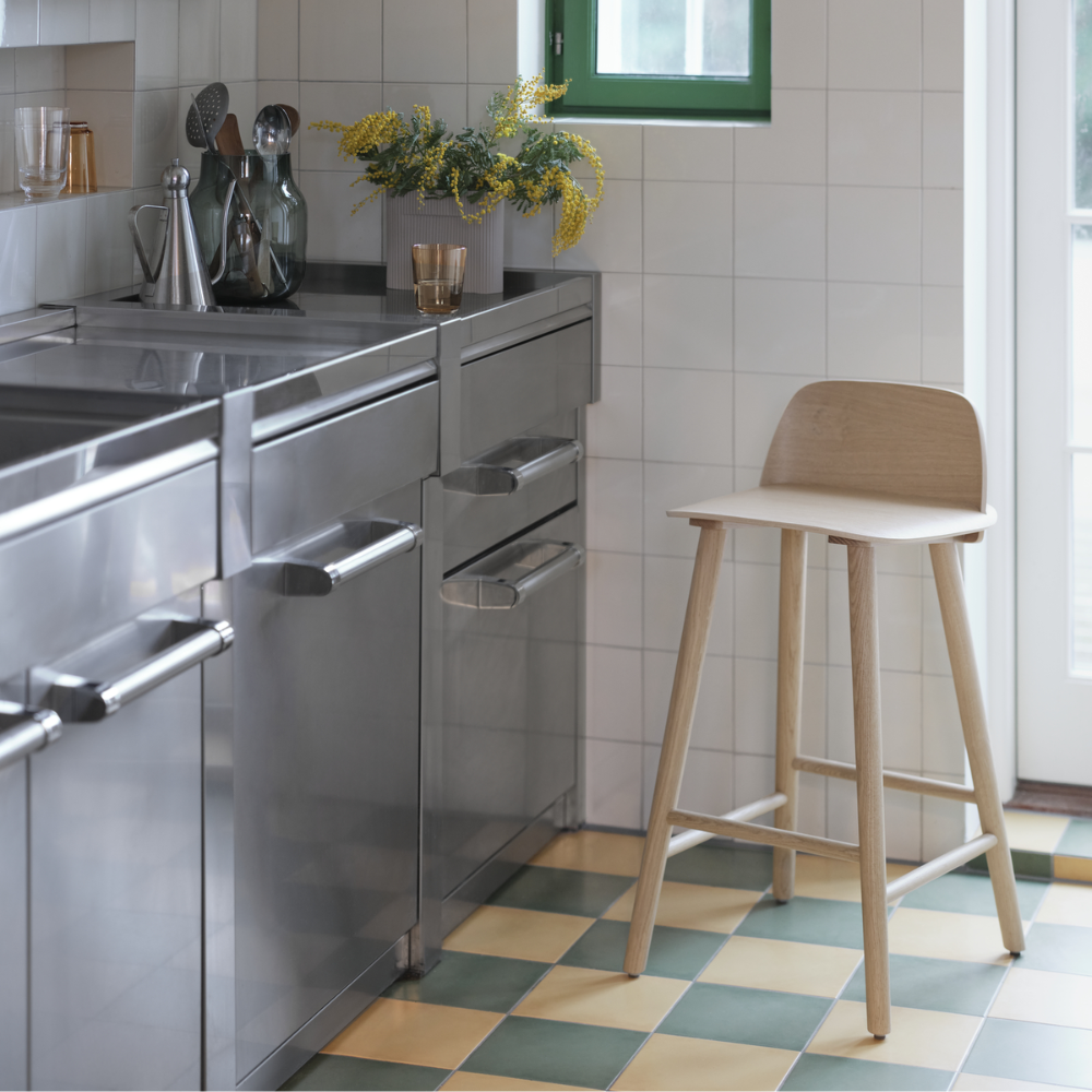 The oak Nerd Bar Stool from Muuto in a kitchen.