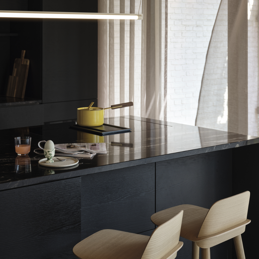 The oak Nerd Counter Stool from Muuto in a dining room.