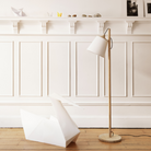 The oak and white Pull Floor Lamp from Muuto in a family space.