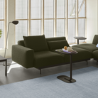 The black Relate Side Table from Muuto in a living room.