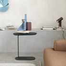 The black Relate Side Table from Muuto in a study.
