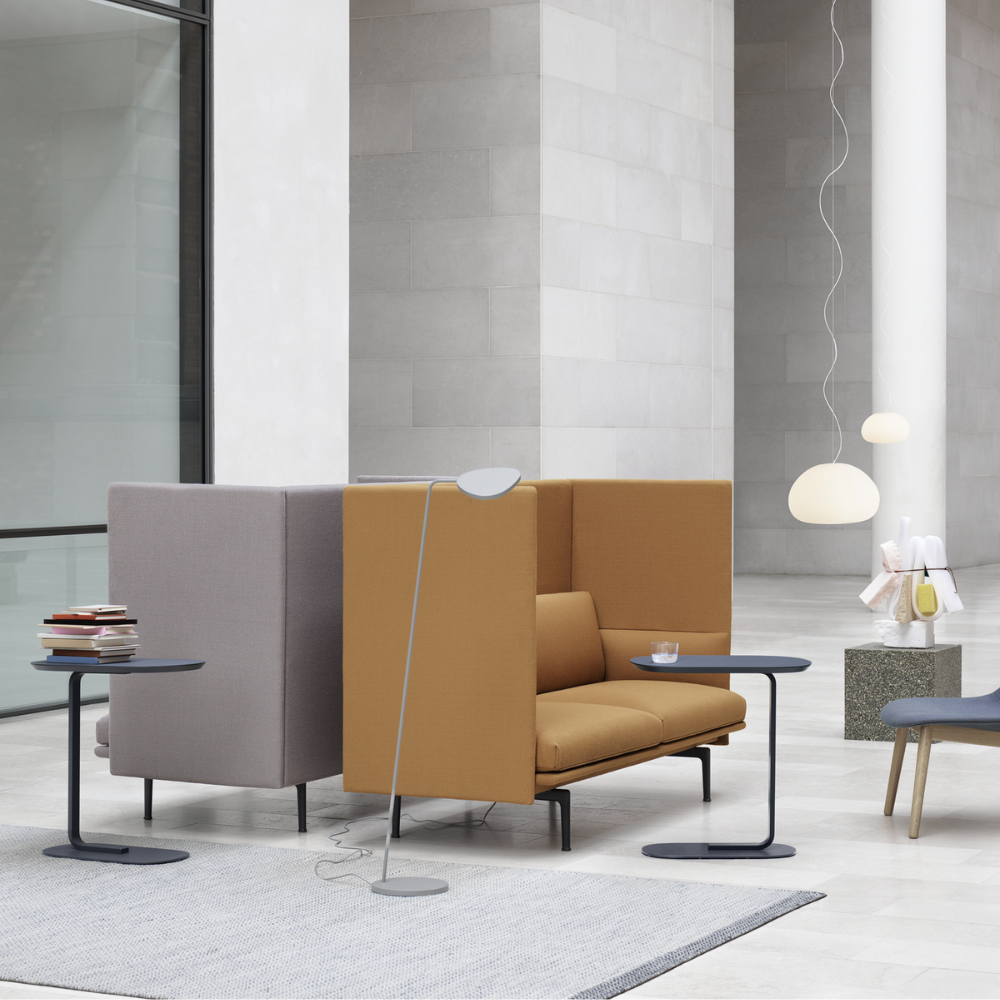 The blue gray Relate Side Table from Muuto in a business space.