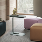 The dark green Relate Side Table from Muuto in a family area.
