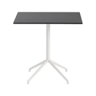 The 29 inch Still Cafe Table from Muuto with the black nanolaminate table top and white frame.