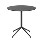 The 29 inch Still Round Cafe Table from Muuto with the black nanolaminate table top and black frame.