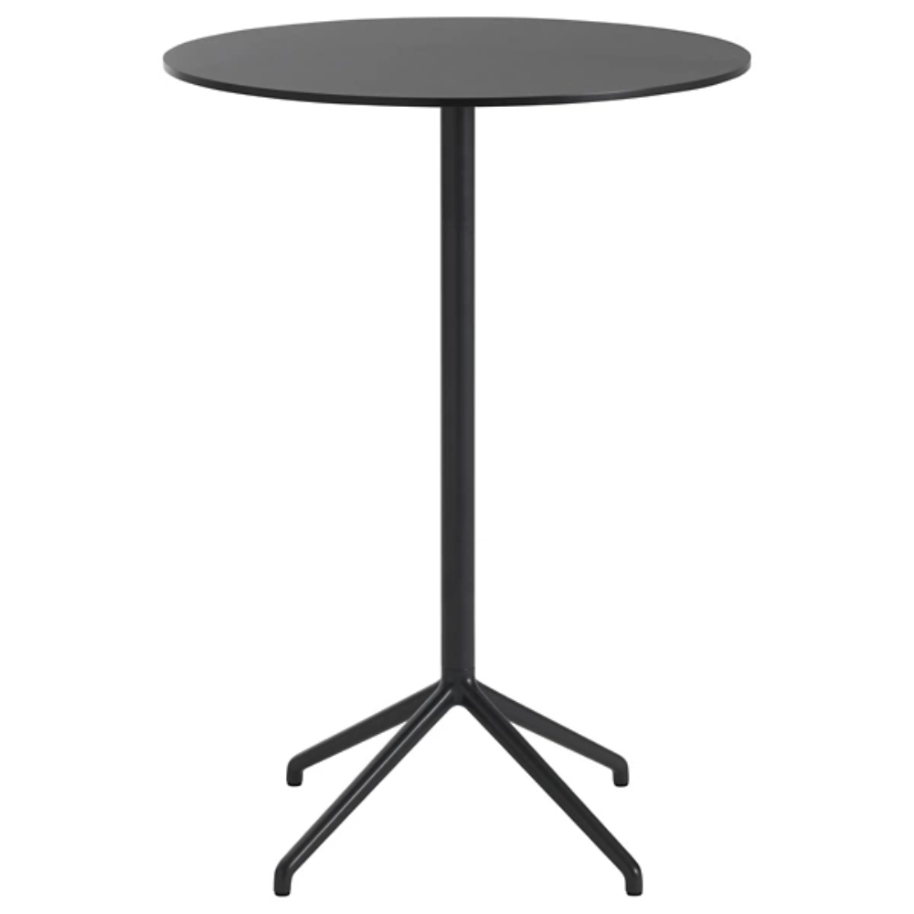 The 41 inch Still Round Cafe Table from Muuto with the black nanolaminate table top and black frame.