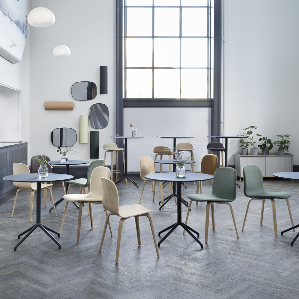 The Still Round Cafe Table from Muuto in a business living area. all-groups
