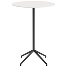The 41 inch Still Round Cafe Table from Muuto with the white nanolaminate table top and black frame.