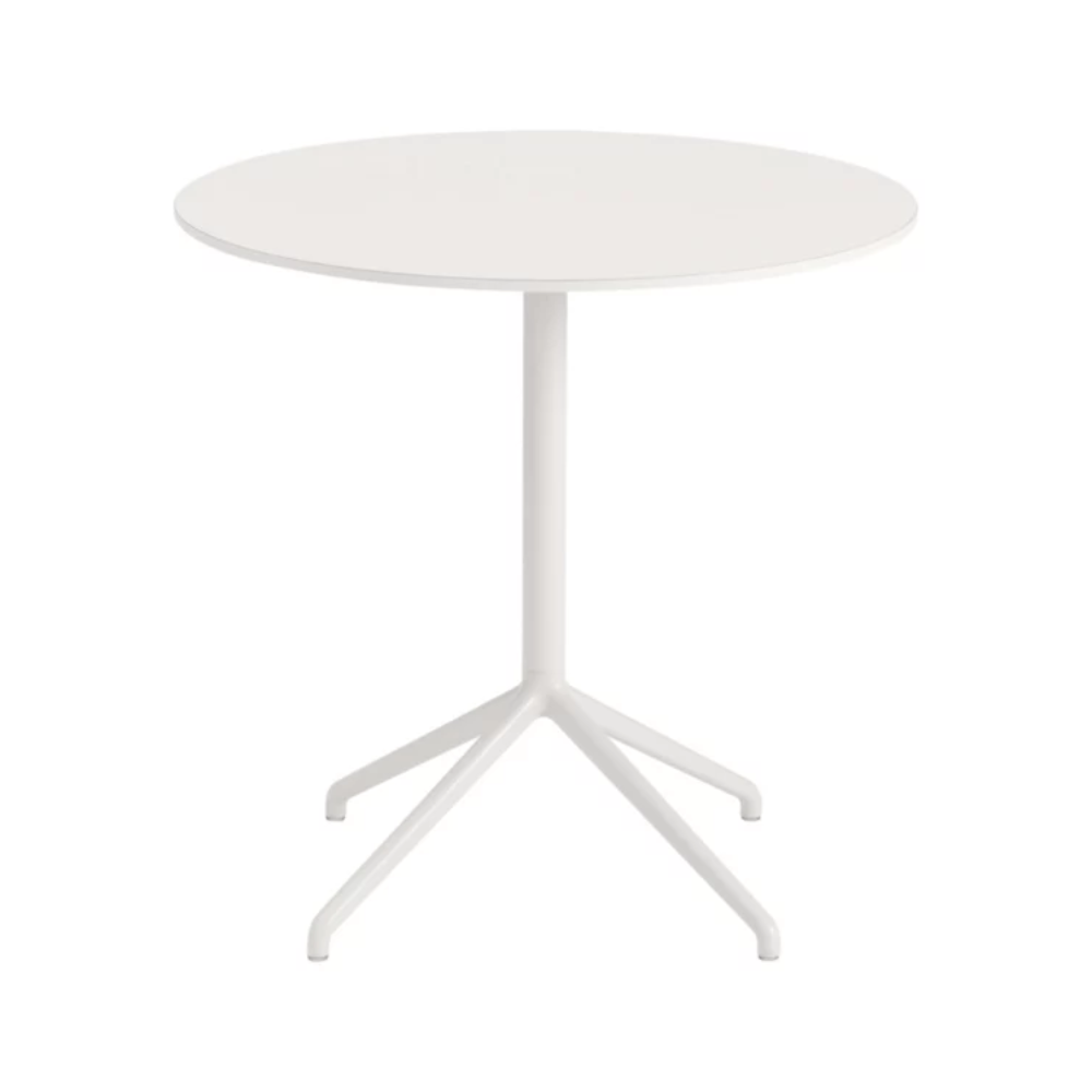 The 29 inch Still Round Cafe Table from Muuto with the white nanolaminate table top and white frame.