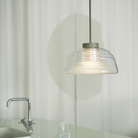 The Two Layer Pendant Lamp Grey from Muuto in a kitchen.