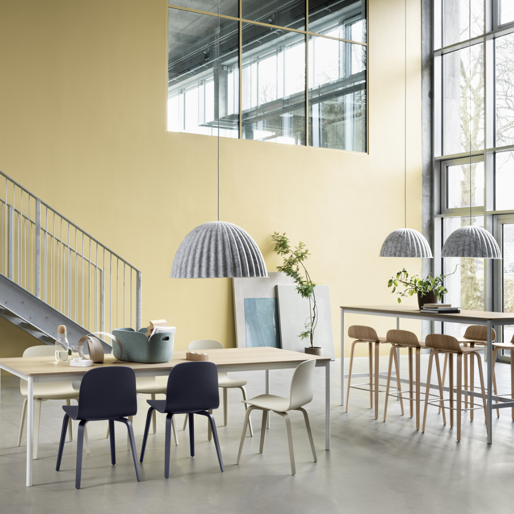 The oak Visu Bar Stool from Muuto in a business space.