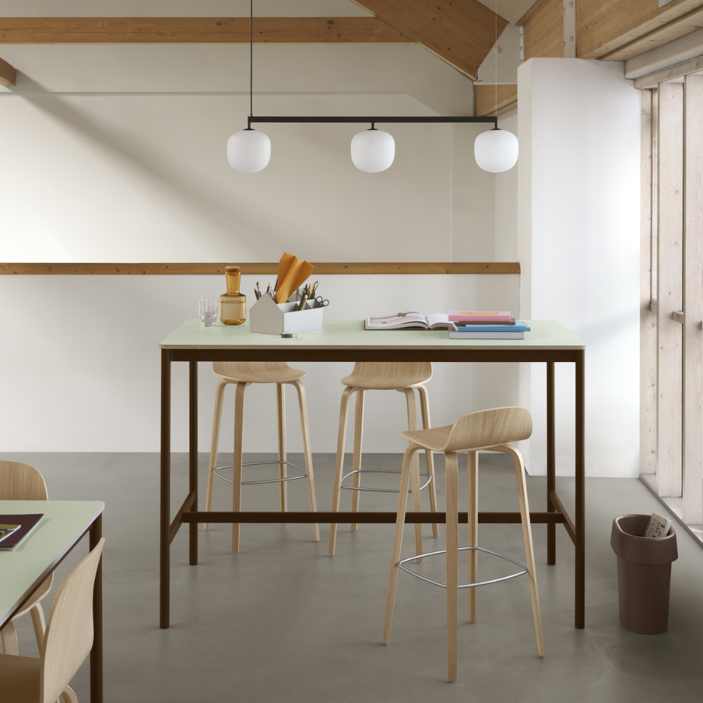 The oak Visu Bar Stool from Muuto in a living room.