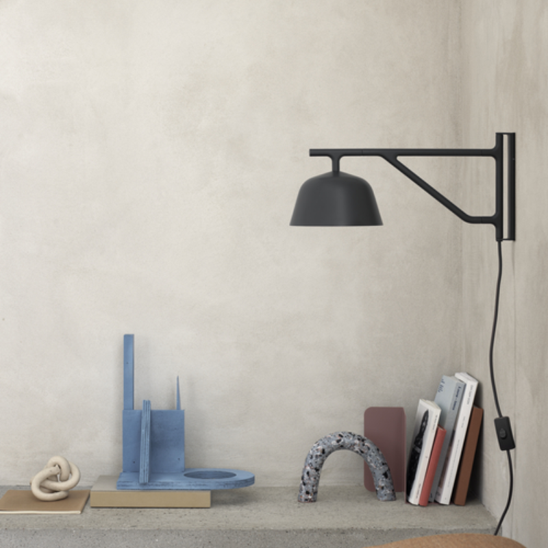 The black Ambit Wall Lamp from Muuto in a home office.