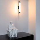 The La Roche Wall Sconce from Nemo in black in a primary bedroom.